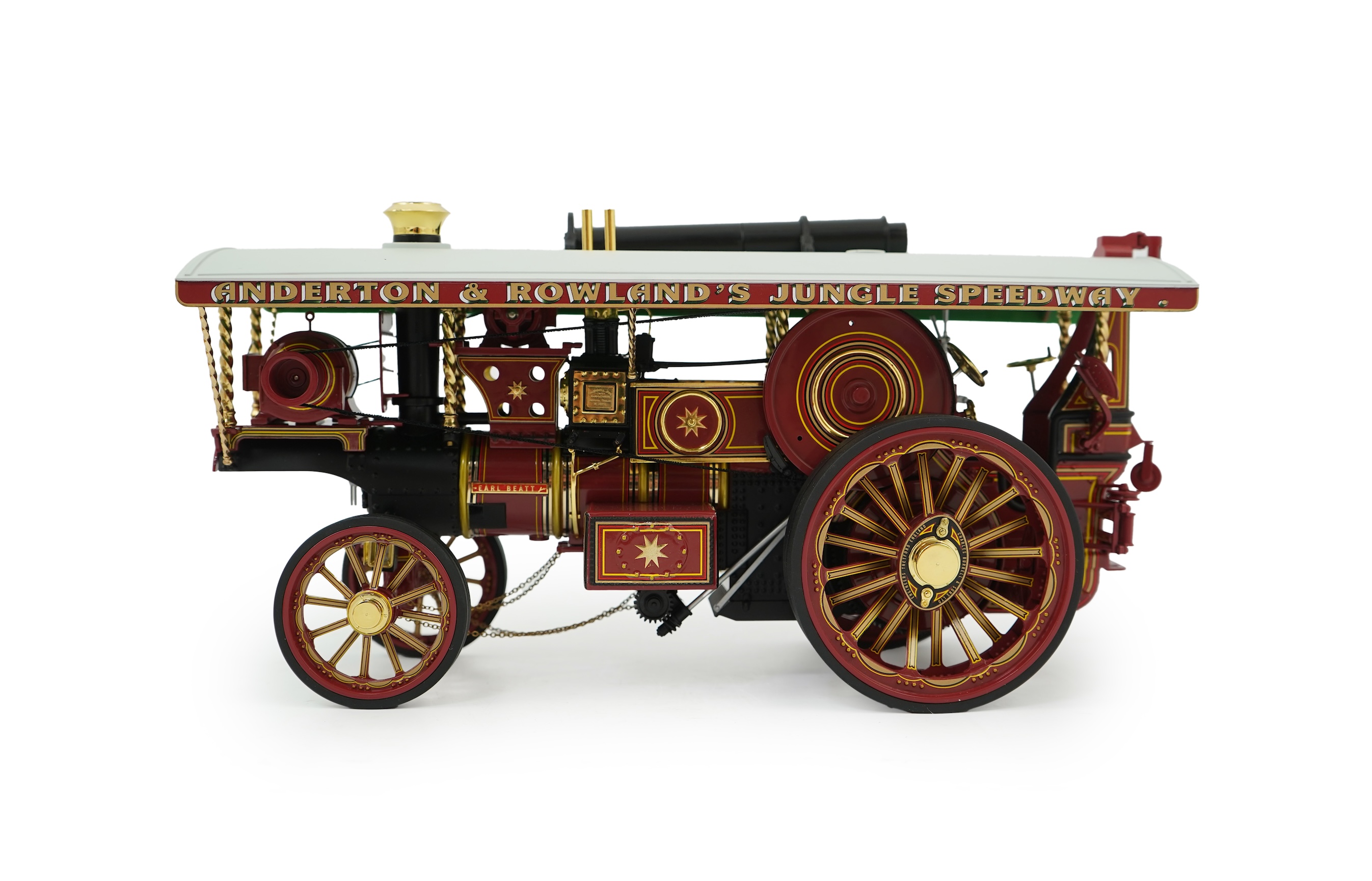 A Midsummer Models Ltd. 1:24 scale model of a Burrell Showman’s Engine, Earl Beatty, in ‘Anderson & Rowland’s Jungle Speedway’ livery, missing the original card box, but with an oak and Perspex display case
